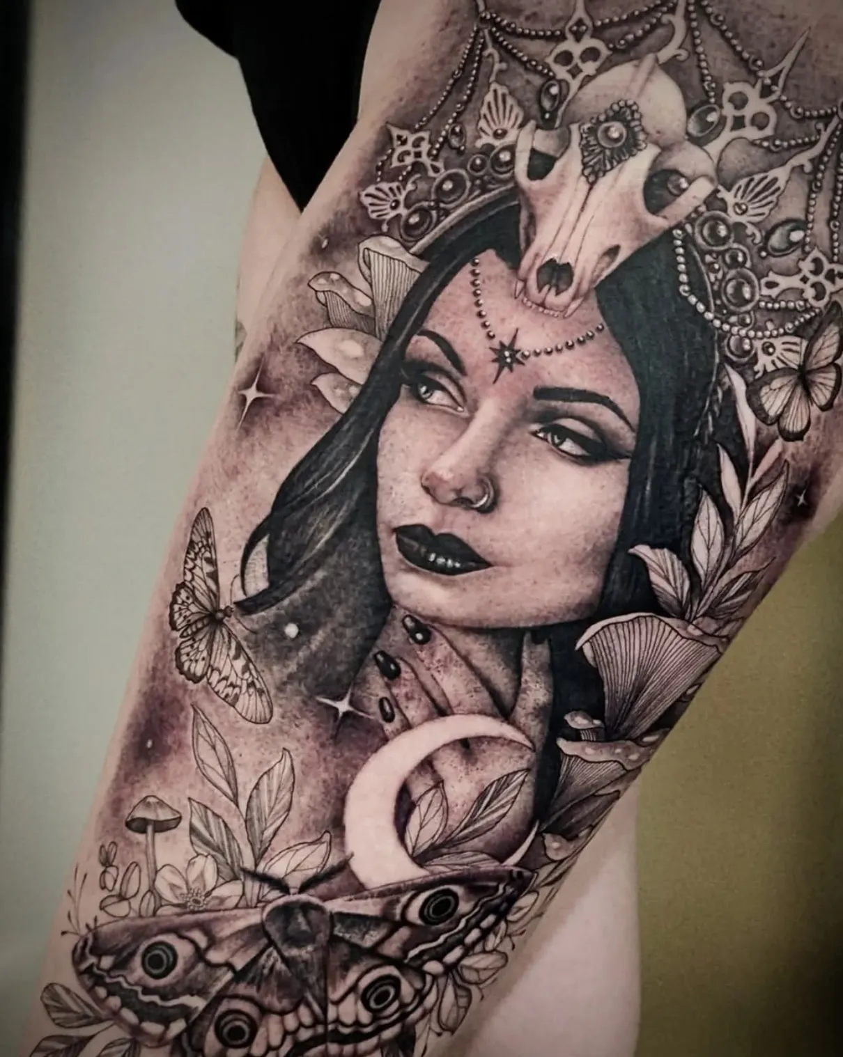 Black and grey portrait of a woman with magical or occult elements